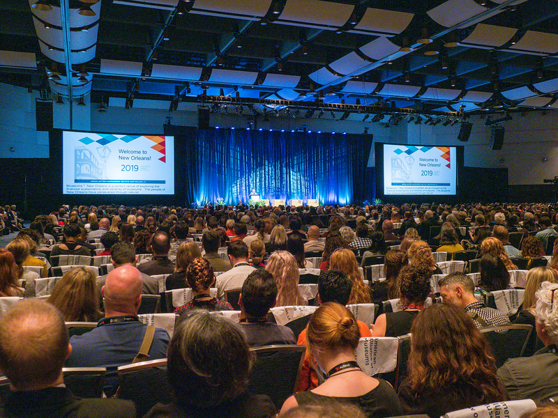 a large audience waiting for the keynote speaker