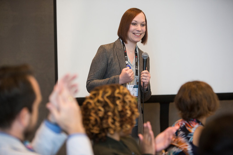 person speaking enthusiastically into microphone